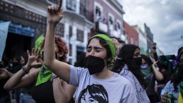 Woman in Mexico marching to celebrate the decriminalisation of abortion in the country in 2023